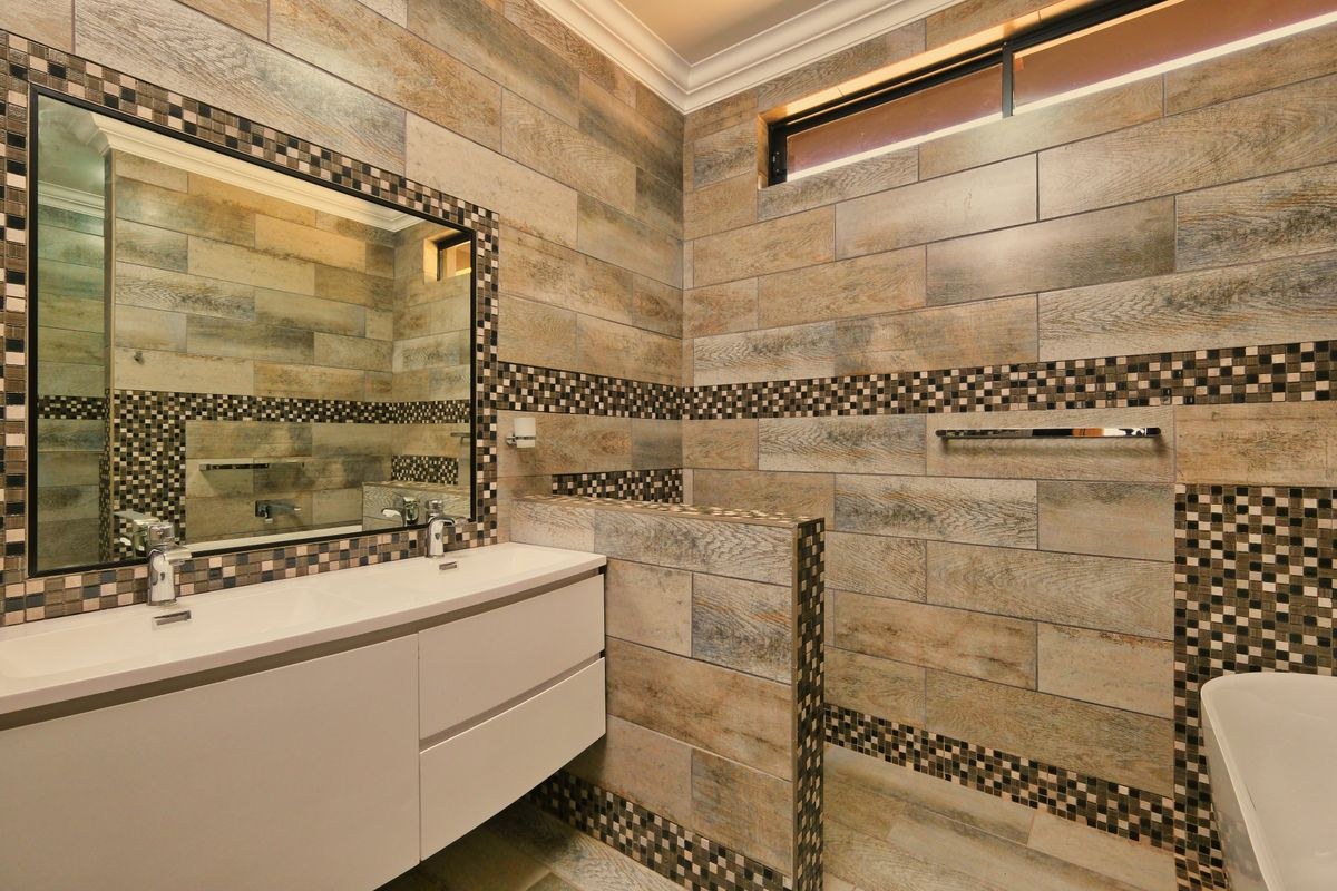 Finished tiled bathroom with a double vanity