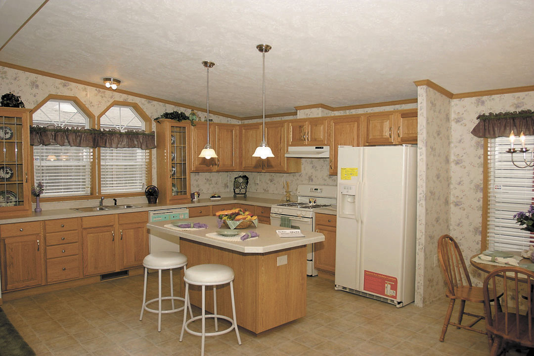 Finished kitchen with wood cabinets and a center island